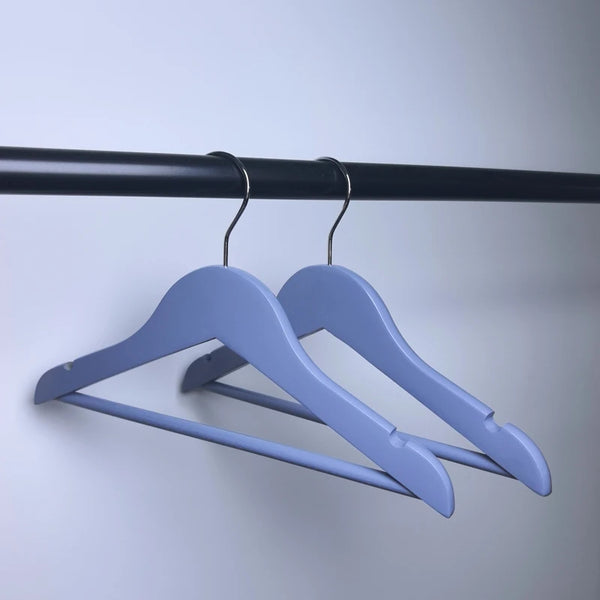 Boutique Wooden Kids Clothing Hanger in light blue, perfect for organizing children's clothing stylishly.