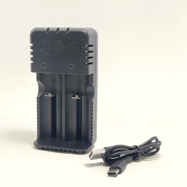 Dual Slot USB Battery Charger with dual slots and USB cable for efficient battery charging.