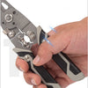 Hand holding a Multifunctional Wire Cable Stripper for stripping, cutting, and crimping tasks.