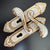 Modern White European Door Handle set featuring intricate designs in gold and white, perfect for stylish interiors.