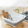 Collapsible Dish Drainer Dinnerware Portable Folding Rack with dishes and utensils in a kitchen setting.