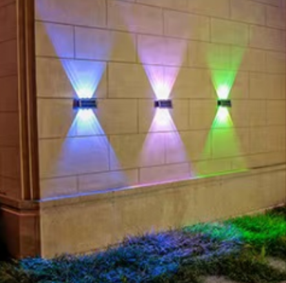 Solar LED RGB Wall Light illuminating a wall with vibrant colors, enhancing outdoor spaces with energy-efficient lighting.