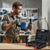 Man using the 1500W Electric Demolition Jackhammer Concrete Breaker Kit to drill into concrete.