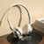 Portable ENC Noise Reduction Over-Ear Headphones resting on a vinyl record, showcasing sleek design and comfort.