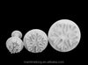 Snowflake Plunger Cookie Cutter Set featuring three snowflake-shaped cutters in varying sizes.