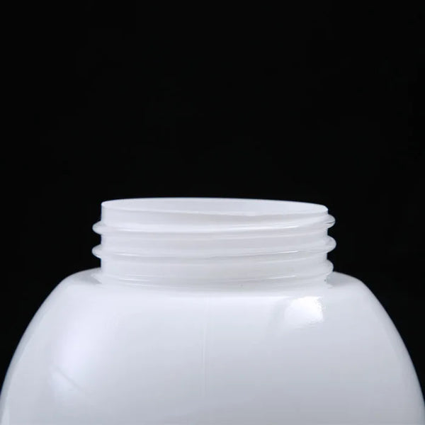 Blown Opal White Glass Globe Ball Lampshade: Close-up view of the opening of a clear plastic bottle with smooth rim and black background.