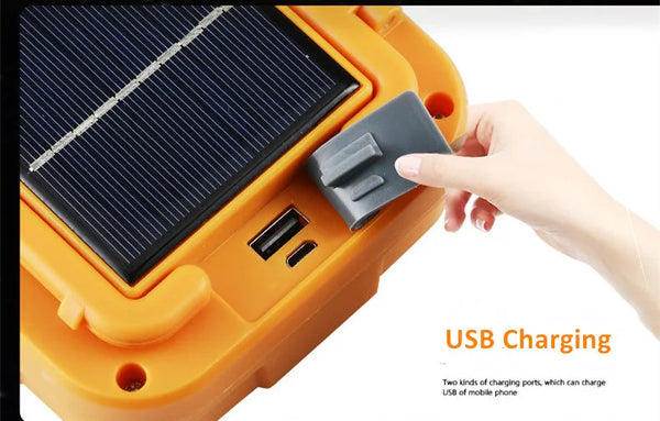 Portable LED Solar Power Flood Light showing USB charging port for mobile devices.