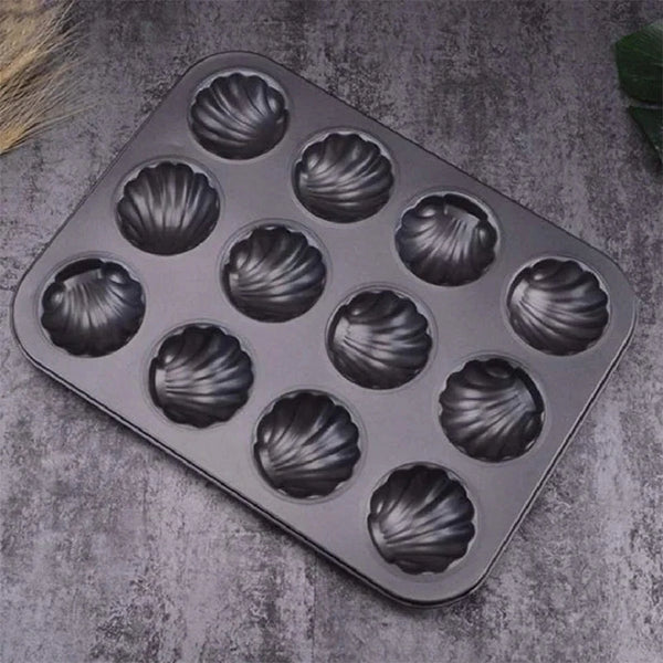 Carbon Steel Shell Shape Baking Mold for making twelve shell-shaped treats.