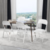 Portable Padded Leather Folding Chair set around a dining table with a view, ideal for versatile seating.