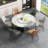 Nordic Leather Dining Chair with Metal Legs around a round marble dining table in a modern setting.