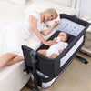Image of a woman lying beside an infant in an Adjustable Multifunction Baby Swing Bed Cradle for safe and soothing rest.