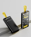 12000mAh Transparent 22.5W Fast Charging Power Bank with digital display and yellow strap on a gray surface.
