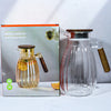 High-Temperature Resistant Dining Table Placemat next to a stylish glass pitcher and box for elegant dining.