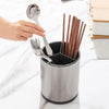 360 Rotating Stainless Steel Utensil Holder with cooking tools and chopsticks on a kitchen countertop.