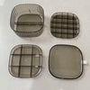 4 different clear glass storage containers with dividing lines for organization on a white surface.
