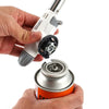 Hands attaching the Windproof Portable Cartridge Gas Torch Lighter to a standard gas cartridge for easy use.