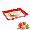 Reusable Stackable Food Preservation Trays with Stretch Covers holding a sandwich and fresh tomatoes.