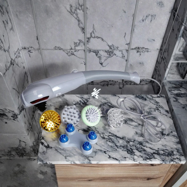 8-Head Infrared Massage Hammer with various massage heads on a marble surface.
