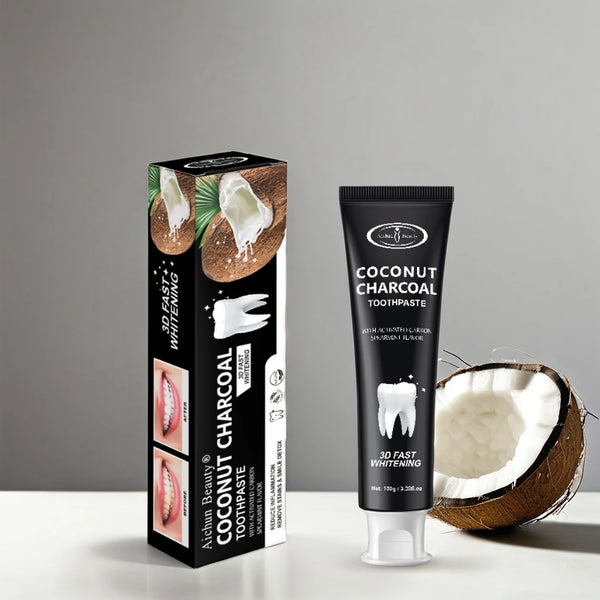 Coconut Charcoal Toothpaste Mint Extract packaging with coconut on a gray background, promoting natural whitening.