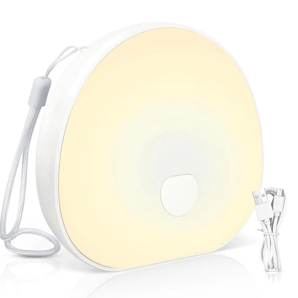 Portable White Noise Sound Machine with USB cable, designed for calming sleep environments.