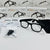 AI Camera Sunglasses with HD Video Recording and accessories displayed on a table.