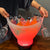 7L Bluetooth LED Ice Bucket with Speaker and Light Effects holding drinks and glasses, illuminated in vibrant colors.