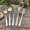 5-Piece Silverware Set Stainless Steel Flatware with stylish textured handles on wooden table.