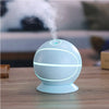 Basketball Mini USB Humidifier Lamp emitting mist with soft ambient light on a wooden table.