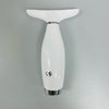 7 in 1 Facial and Neck Massager shown from above on a gray background, white ergonomic design with chrome accents.