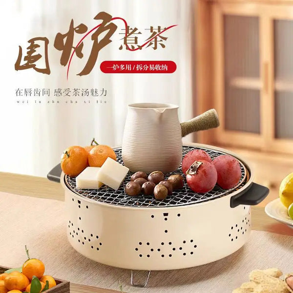 Portable Charcoal Grill & Outdoor Cooker with tea kettle, fruits, and cheese for versatile outdoor cooking.