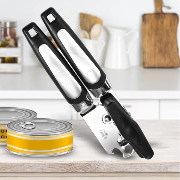 Stainless Steel Manual 3-in-1 Can Opener on a kitchen counter beside opened cans.