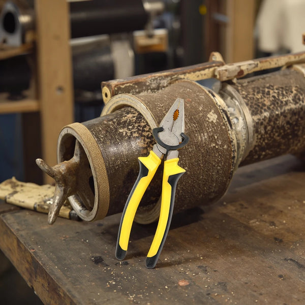 8-Inch Steel Cutting Pliers on a workbench showcasing its heavy-duty design for industrial use.
