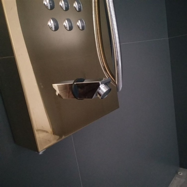 Golden Stainless Steel LED Shower Panel System with controls and hose, featuring a luxurious golden finish.