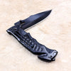 Non-Slip Stainless Steel Folding Meat Knife on a soft surface, showcasing its sleek design and sharp blade.