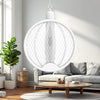 Rechargeable Electric Mosquito Swatter hanging in a bright living room with a cozy sofa and plants.
