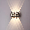 Waterproof Square Aluminum Tempered Glass LED Wall Light illuminating a wall with modern design and ambient lighting.