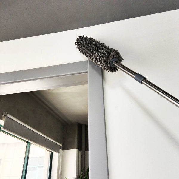 Cleaning high ceilings with Telescopic Microfiber Removable Duster for dust-free surfaces.