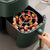 Air Fryer Barbecue Grill Rack and Skewer Set in use, showcasing skewered food and grill rack inside an air fryer.