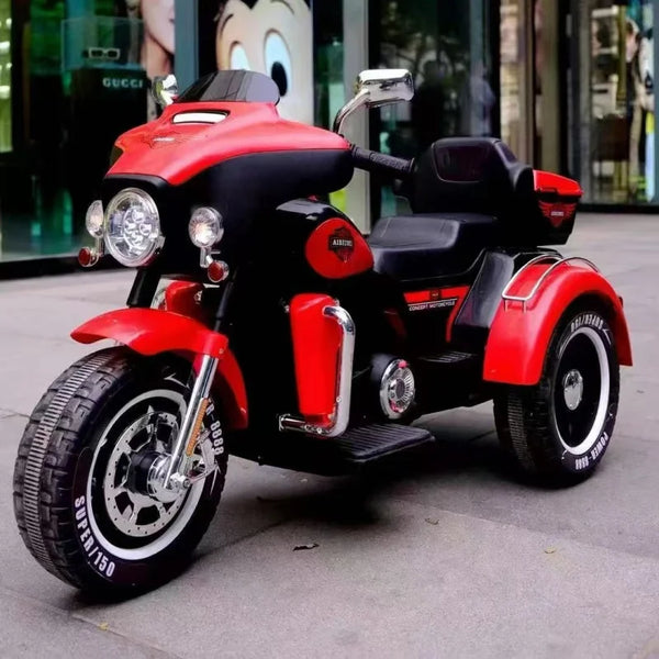 12V Plastic Powered Big Size Electric Motorbike on city street, designed for outdoor play with three stable wheels.
