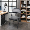 Black Padded Folding Chair with Steel Frame in a modern workspace setting.