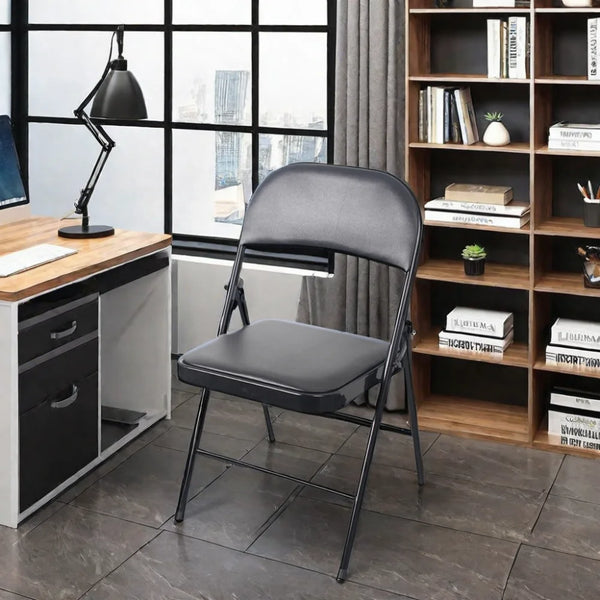 Black Padded Folding Chair with Steel Frame in a modern workspace setting.