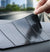 Anti-Slip Mobile Phone Stand and Holder on a dashboard, showcasing its grip and stability.