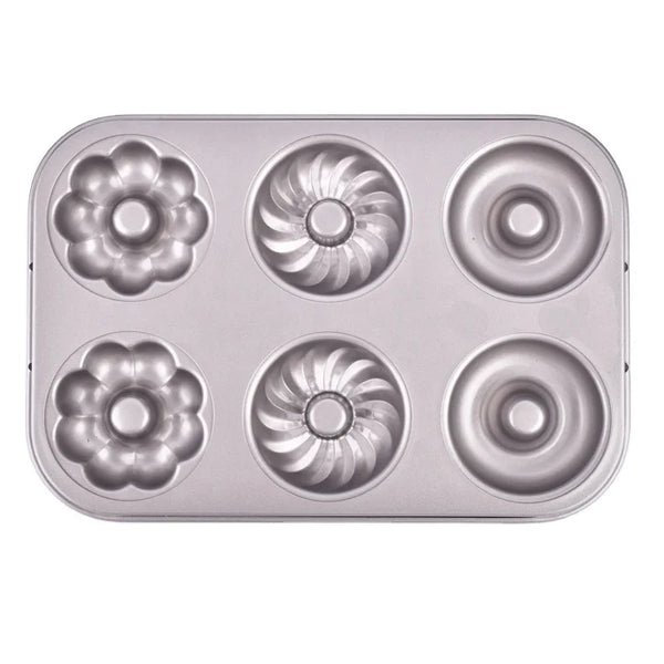 Non-Stick 6-Cavity Mini Fluted Tube Pan showing six distinct fluted designs for baking elegant desserts.