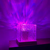 USB Ocean Wave Dynamic Water Ripple Pattern Lamp projecting soothing purple water ripple effects onto the wall.