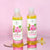 Pure Natural Rose Essential Oil bottles for hair and skin nourishment on a pink background.