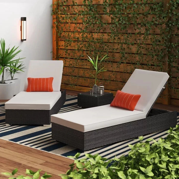 Outdoor Garden Lounge Daybed Wicker Deck Bed with white cushions and orange accents in a lush garden setting.