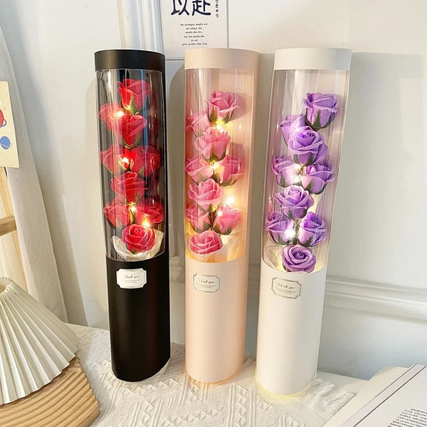 Cylinder Floral Display Box with Soap Roses in three colors, featuring elegant roses and ambient lighting.