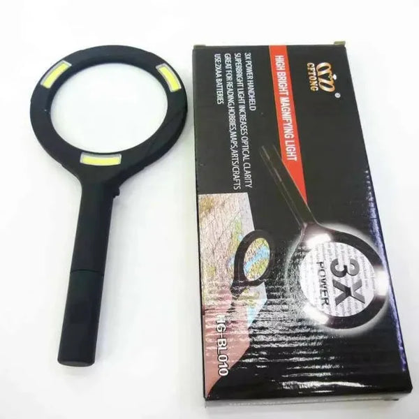 Handheld Magnifying Glass with LED Light displayed next to its packaging, showcasing 3x power and bright lighting features.