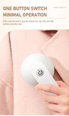 Portable USB Rechargeable Fabric Shaver and Lint Remover in use with one button operation, keeping clothes looking new.