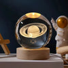Crystal Milky Way LED Globe - 8 cm on a wooden base illuminating a mesmerizing engraved galaxy.